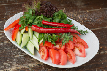 salad of cucumber pepper basil dill parsley and tomato