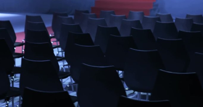 View of empty Conference hall with comfortable seats. conference room for the business audience. Free empty chairs or armchairs. In anticipation of the beginning of the seminar or lecture