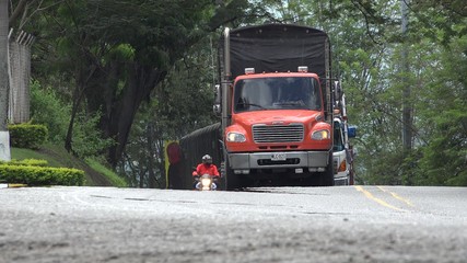 Fototapeta na wymiar Delivery Truck Driving On Road