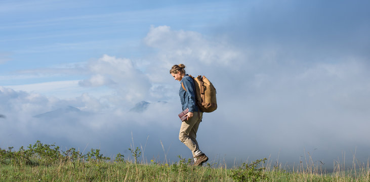 Young woman walking outdoor in the nature