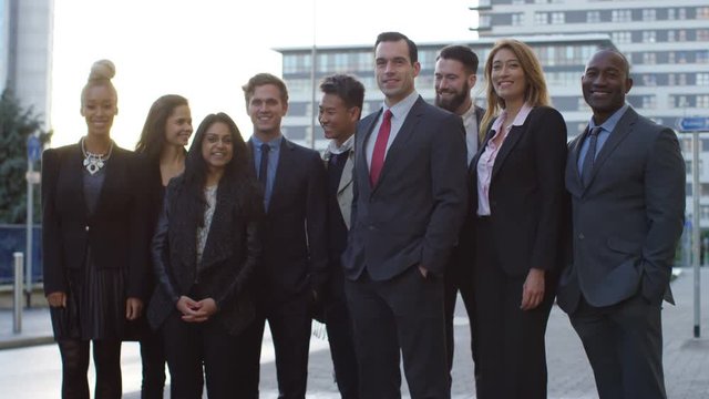  Portrait smiling diverse business group outdoors in the city