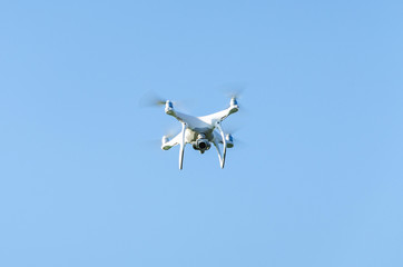 Quadcopter against a blue sky background
