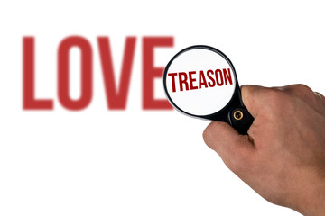 blurred love lettering, in a magnifying glass treason