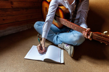 girl with a guitar who writes a song