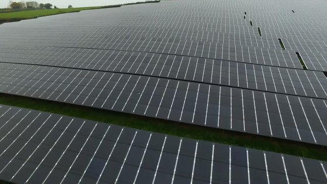 Aerial drone footage of installation of solar panels in English countryside