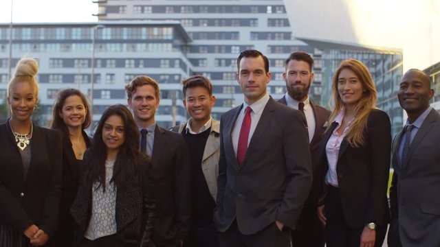  Portrait smiling diverse business group outdoors in the city