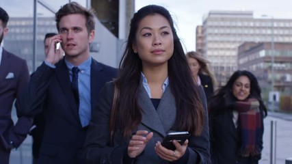  Diverse crowd of city workers walking to work in the morning