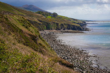 Coastal cliffs and rocky beach along Dingle Peninsula