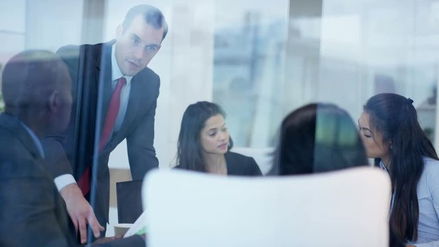  Corporate business management team in boardroom meeting in city office