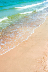 White bubble of Sea wave on the beach