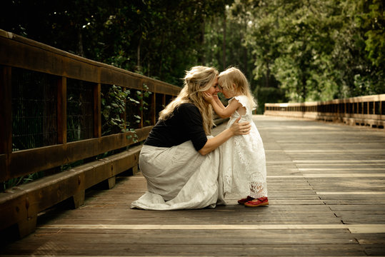 Mother with daughter at pier