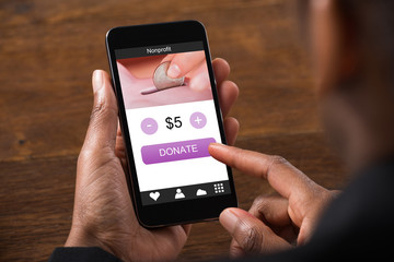 Businesswoman Using Online Banking Service On Mobile Phone