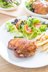 grilled chicken steak with french fries and vegetable salad