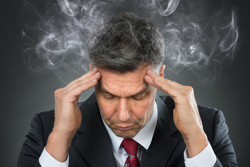 Businessman Suffering From Headache