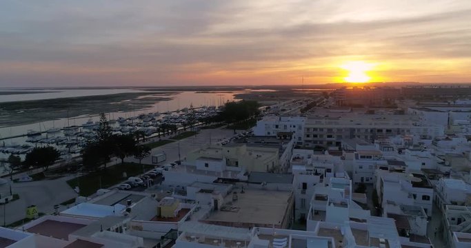 Sunset aerial cityscape in Olhao, Algarve fishing village view of ancient neighbourhood of Barreta, and its traditional cubist architecture.