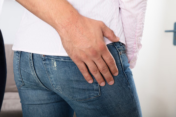 Man Touching Woman's Buttock