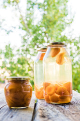 Apricot compote in a glass jar outdoor