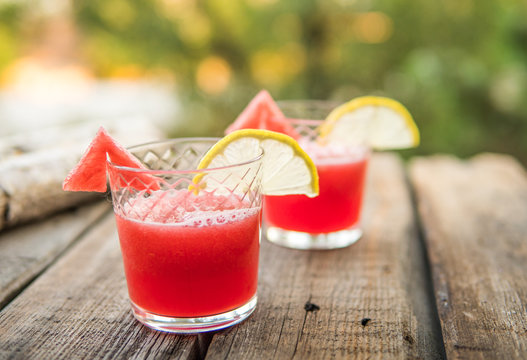 Watermelon juice on a wooden table. Rustic style
