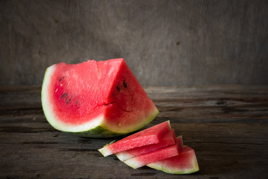 Watermelon on the wooden background. Organic watermelon