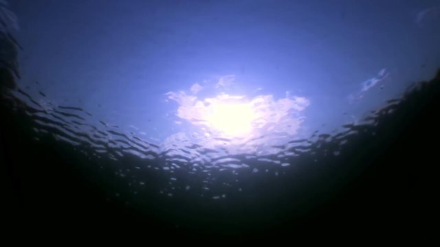 Reflection of sunlight underwater. Relaxation and privacy. Amazing background for stock footage.