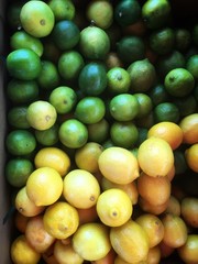 Lemon limes in a gradient pattern in a pile