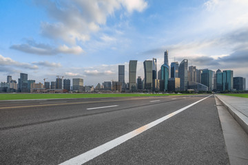 Fototapeta na wymiar urban traffic road with cityscape in background in Shanghai, China..