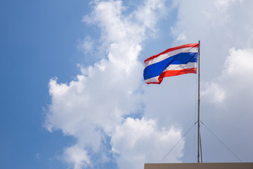 Naklejka premium Thailand flag with blue sky and clouds.