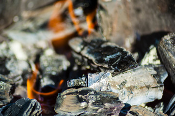the smoldering coals
