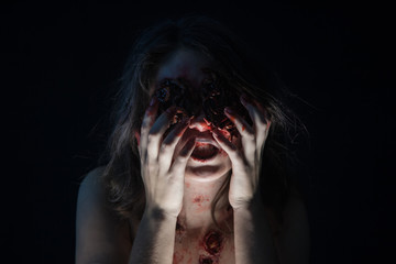 Portrait of a girl with realistic ulcers and worms crawling out of her eyes. creative halloween...