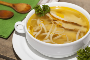chicken noodle soup on the kitchen table