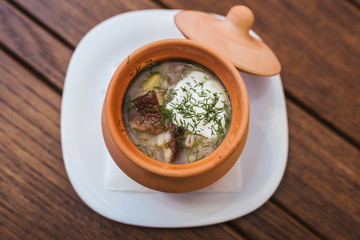Mushroom soup in a clay pot
