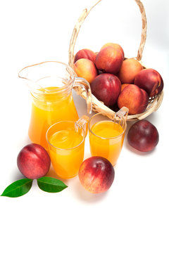 juice and fresh peaches  on white background