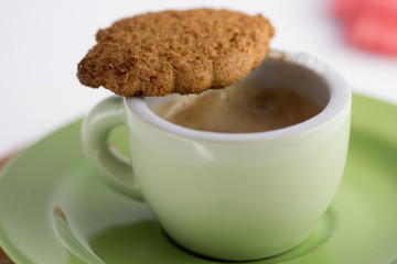 dunking a biscuit in espresso coffee
