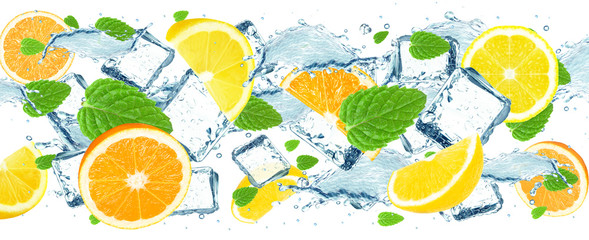 lemon and lime splash water and ice cubes isolated on white