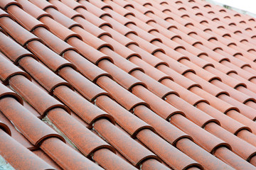Close up on roof construction with ceramic tiles