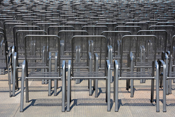 Rows of metal chairs.