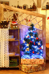 Christmas and New Year decorated interior dining room or cafe with presents and decorated New year tree
