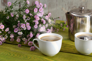 Coffee and flowers.
