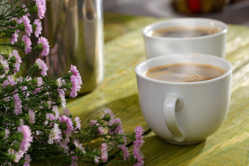 Coffee and flowers.
