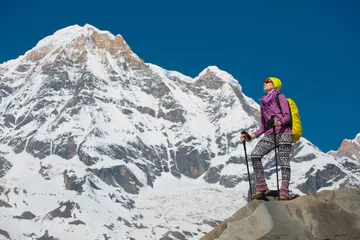 Fotobehang Girl on the background of mountain peaks   © Sergei Malkov