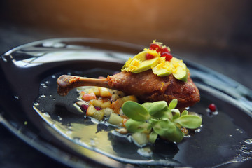 duck confit in black tone food