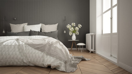 Scandinavian minimalist bedroom with big window and herringbone parquet, white and gray interior design, close-up