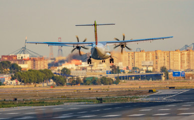 Fototapeta premium Propeller plane landing in the airport