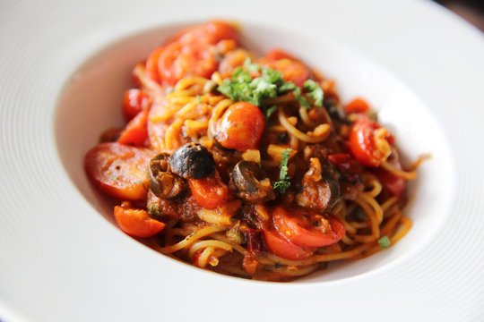 Spaghetti witn tomato and olive , Italian food