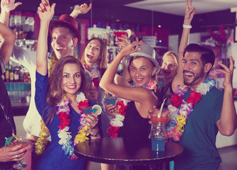 Friends dancing on hawaiian party