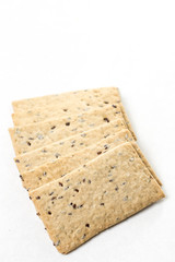 Flax chips isolated above white marble background table