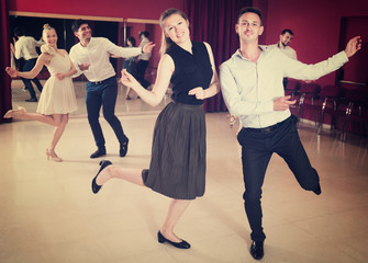 Dancing couples enjoying active dance