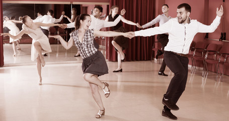Dancing couples enjoying latin dances