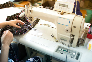 Clothing factory women workers use sewing machines to process Clothing