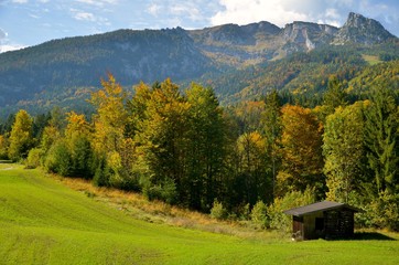 Autumn mountains and forest with isolated small wooden house/cottage. Photo from Lofer area, Austrian Alps.